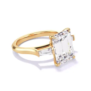 EMERALD CUT DIAMOND ENGAGEMENT RING WITH A BAGUETTE FLANK THREE PHASES SLIM SETTING IN 18K YELLOW GOLD