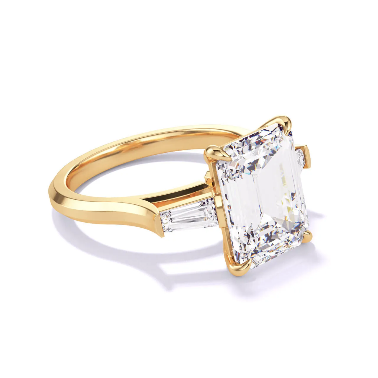 EMERALD CUT DIAMOND ENGAGEMENT RING WITH A BAGUETTE FLANK THREE PHASES SLIM SETTING IN 18K YELLOW GOLD