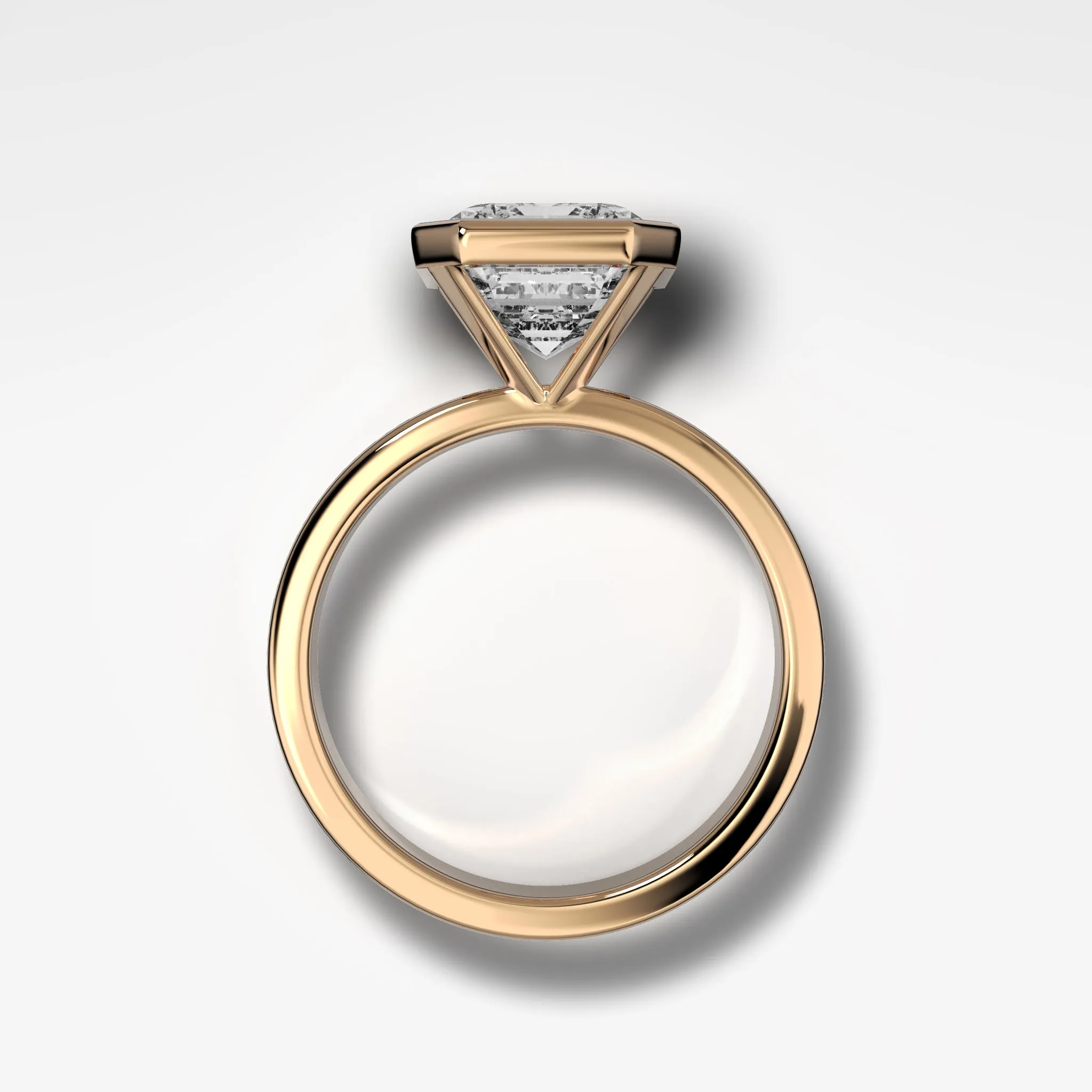 Finest Bezel Set Engagement Ring With Emerald Cut Diamond