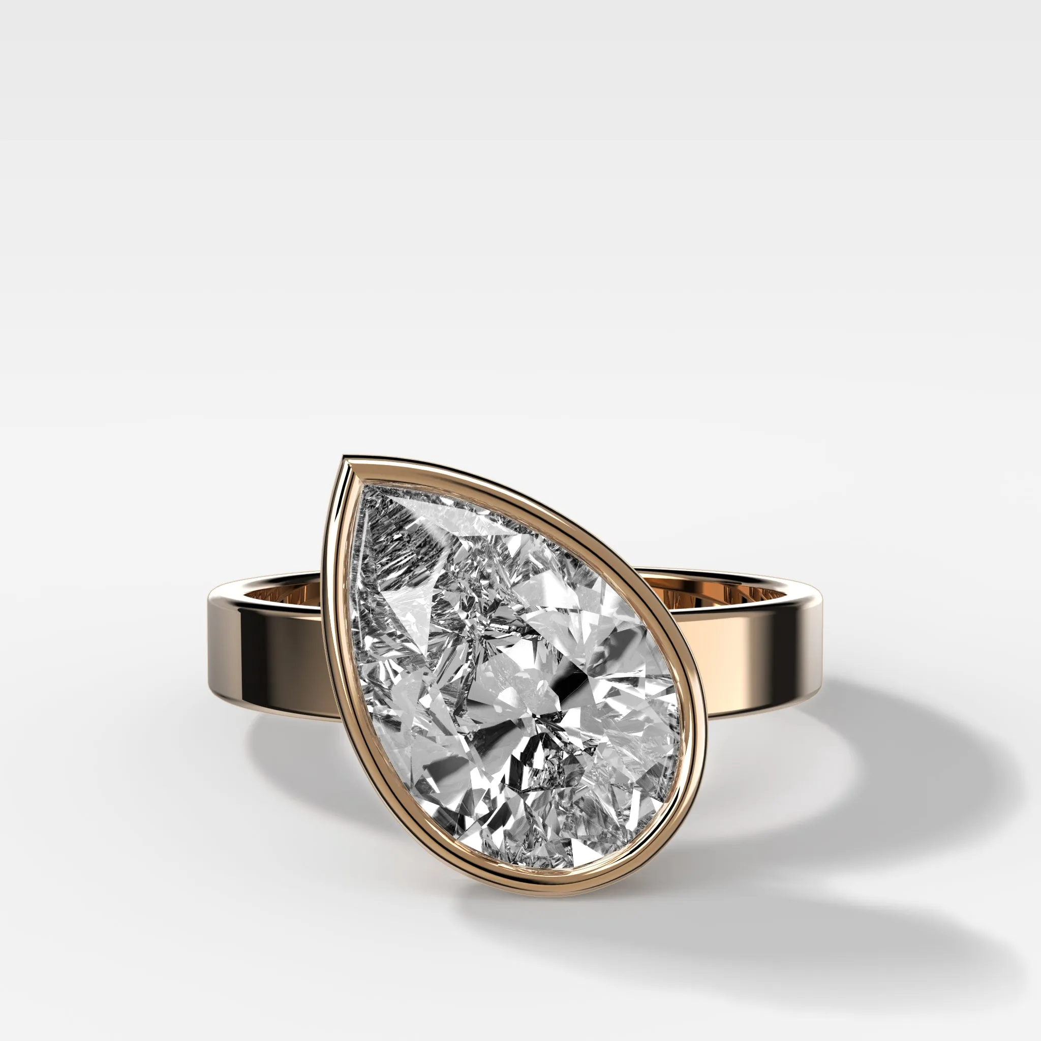 Finest Bezel Set Engagement Ring With Tilted Pear