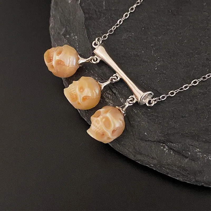 Gothic Three Stone Pearl Skulls Necklace