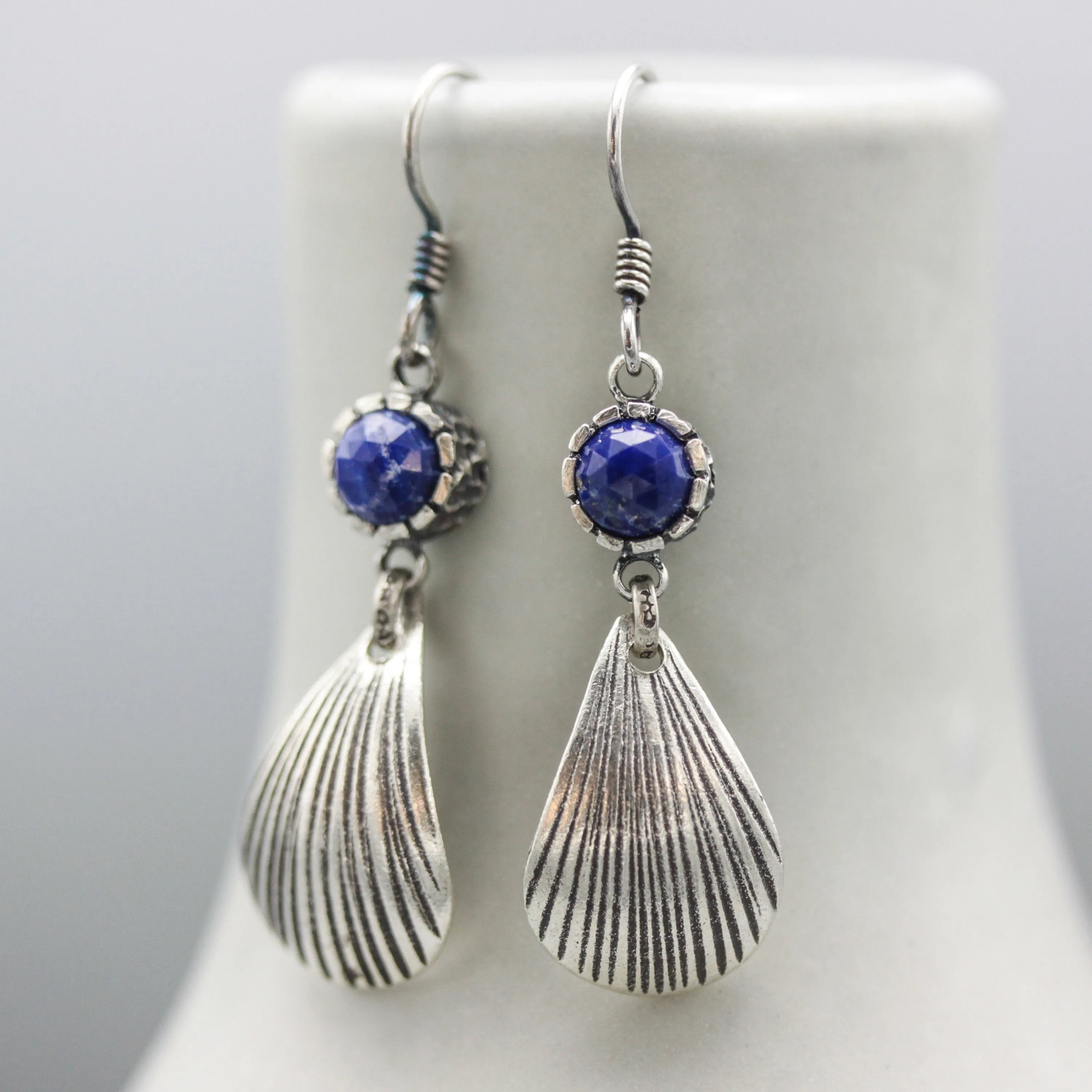 Lapis luzuli earrings in silver bezel setting with sterling silver shell shape on silver hooks style