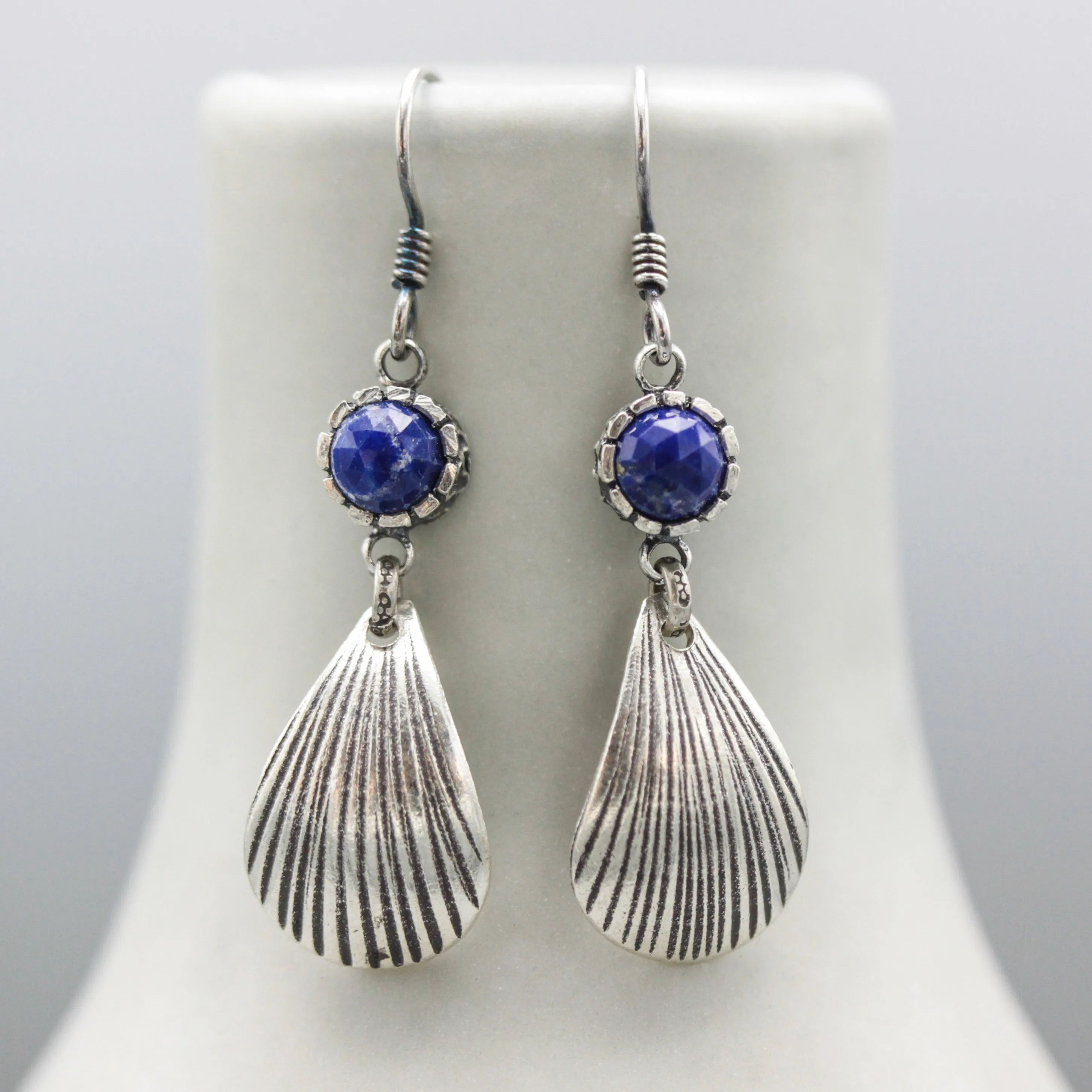 Lapis luzuli earrings in silver bezel setting with sterling silver shell shape on silver hooks style