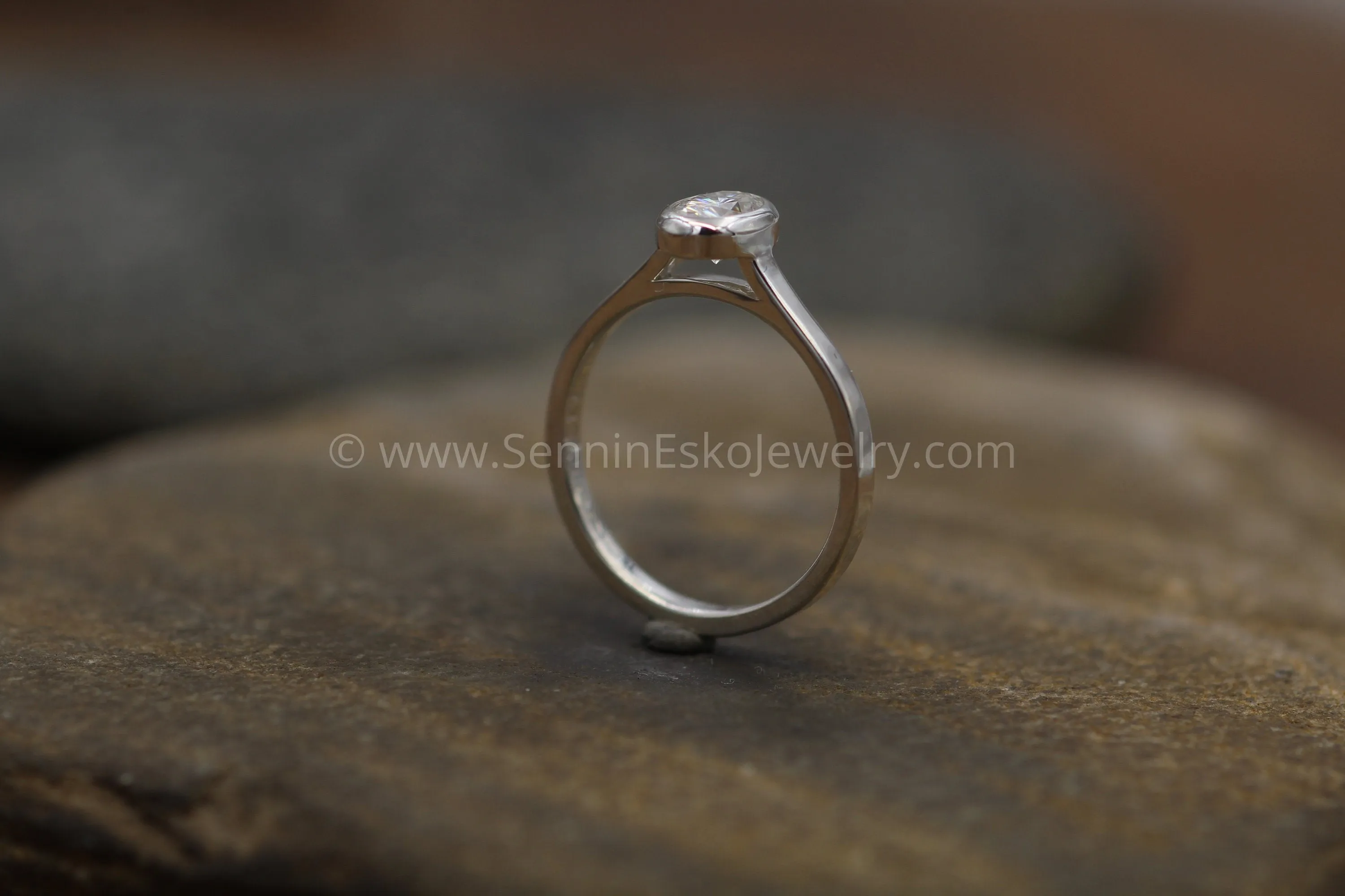 Moissanite 4x6mm Oval Peekaboo Bezel Solitaire Ring -  Forever One Moissanite