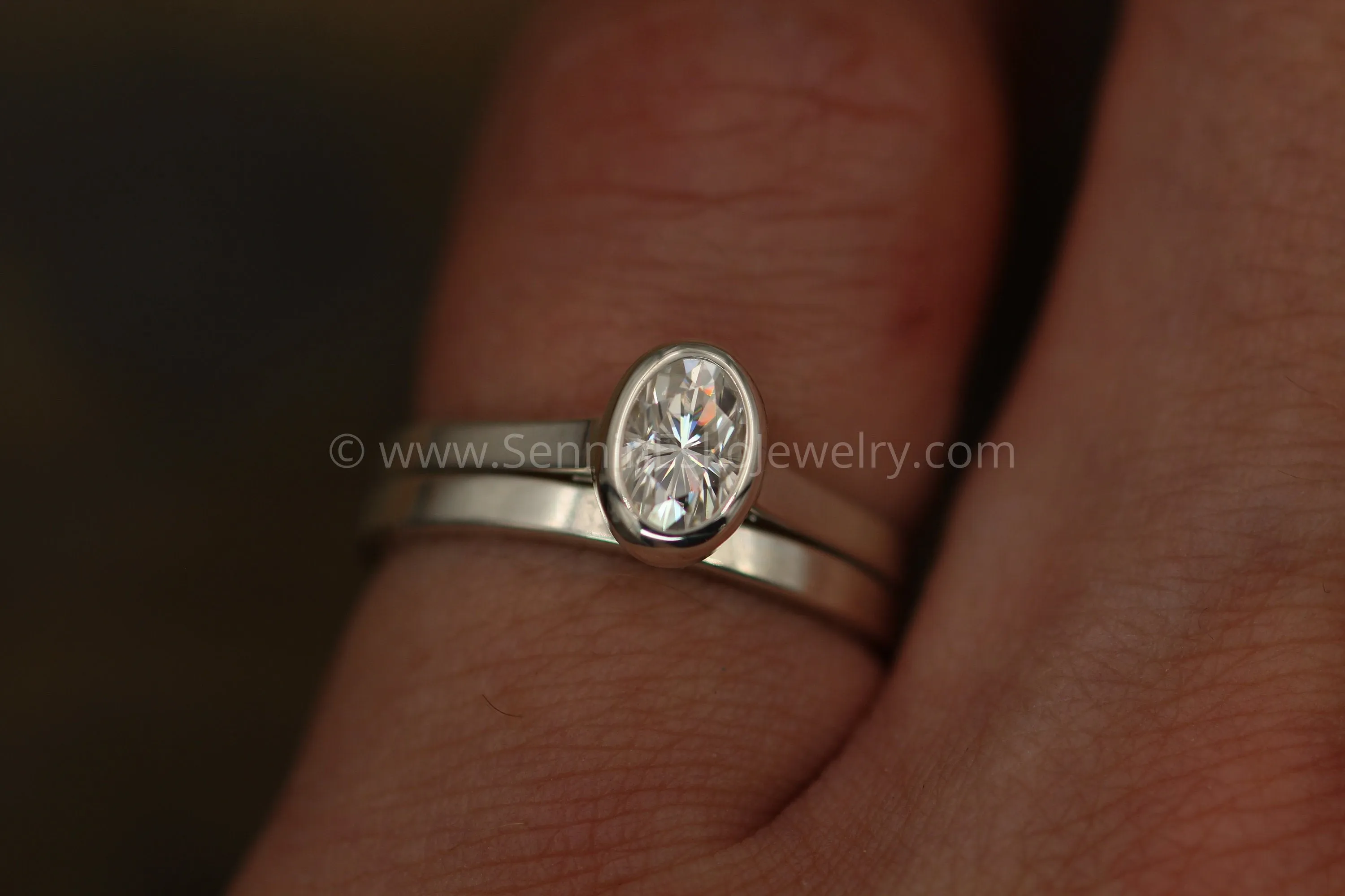 Moissanite 4x6mm Oval Peekaboo Bezel Solitaire Ring -  Forever One Moissanite