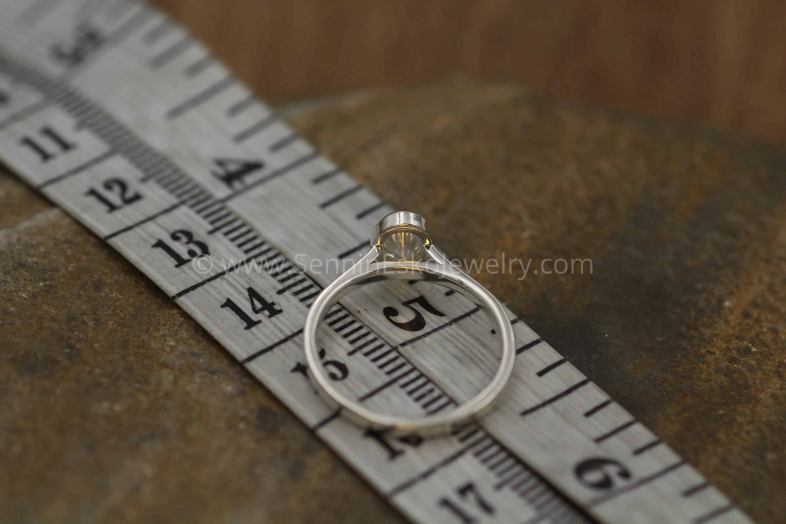 Moissanite 4x6mm Oval Peekaboo Bezel Solitaire Ring -  Forever One Moissanite