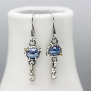 Oval blue kyanite earrings in silver bezel and prongs setting with silver beads on oxidized sterling silver hooks style
