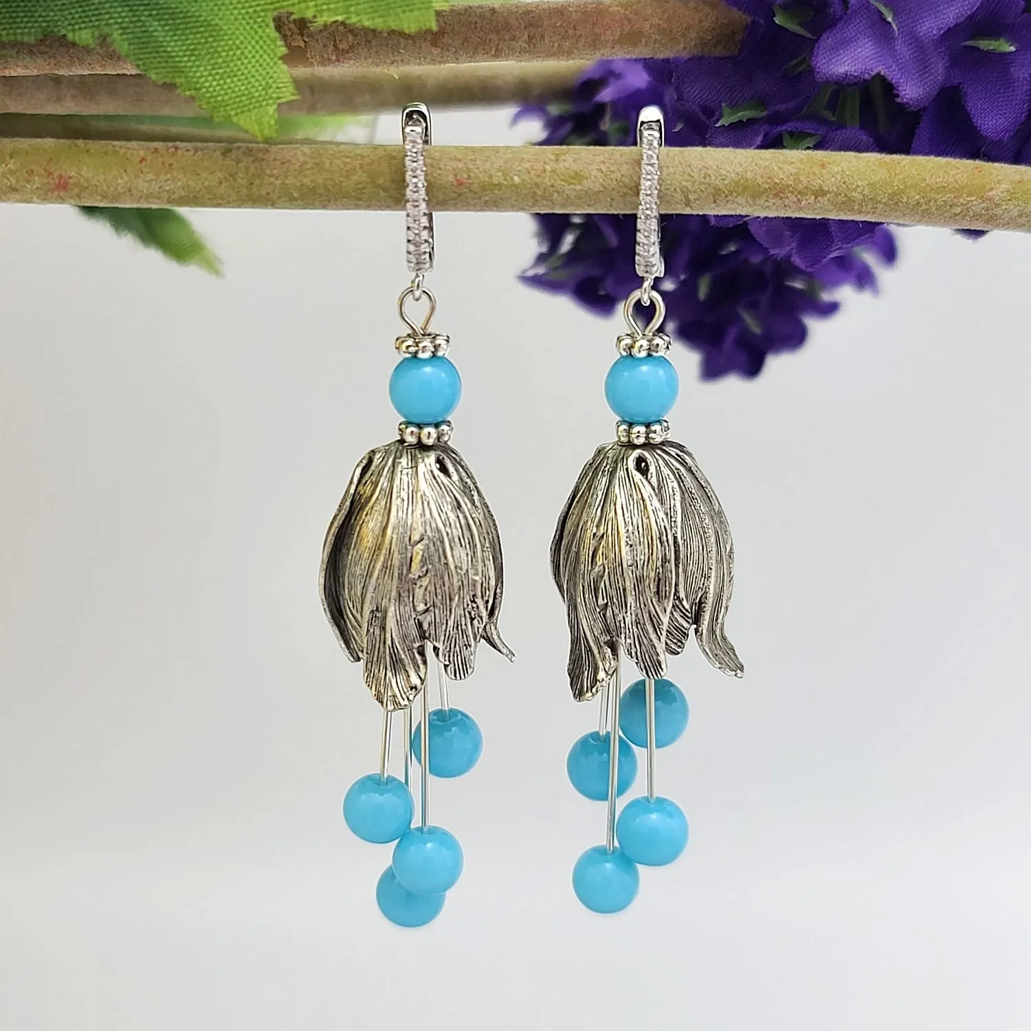 Silver Tulip Earrings with Sky Blue Bead  and Cubic Zirconia Hooks.