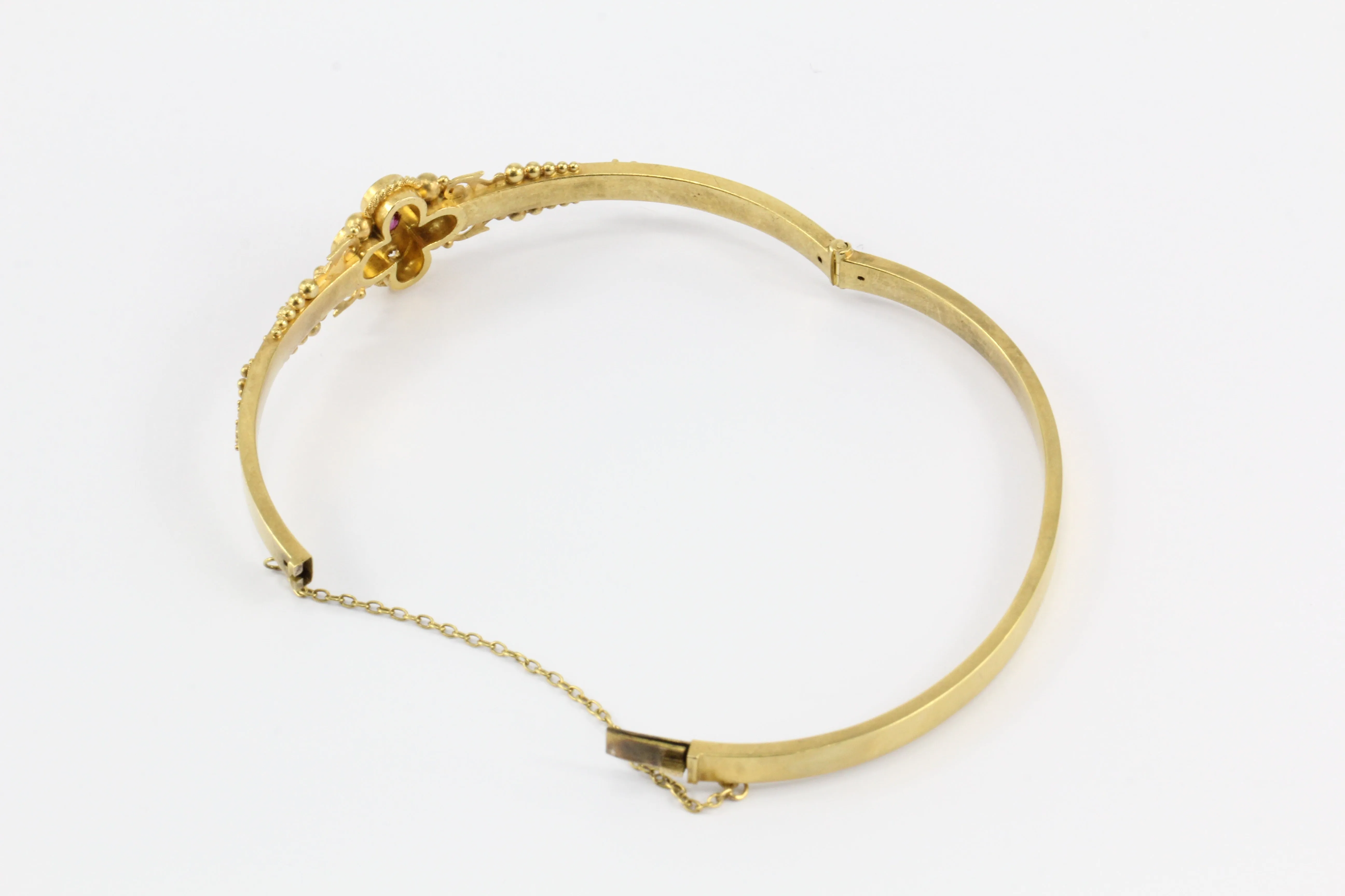 Victorian 15 CT Yellow Gold Ruby and Diamond Quatrefoil Motif Bangle Bracelet
